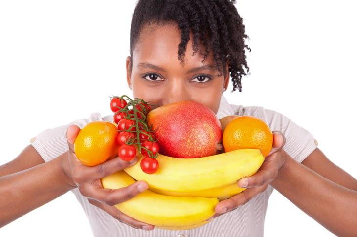 Woman with fresh fruit