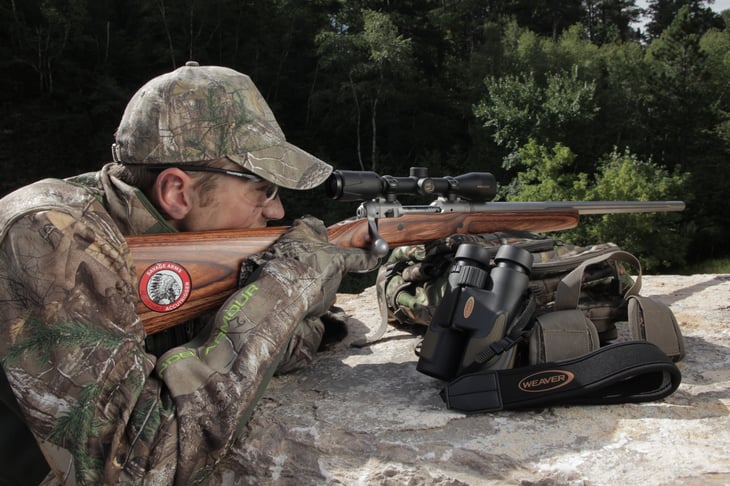 Hunter with Savage Arms brand rifle