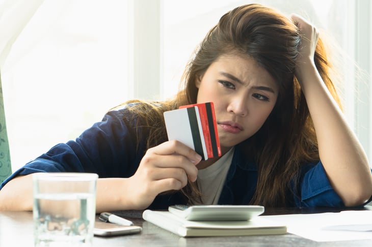 Unhappy woman with credit cards