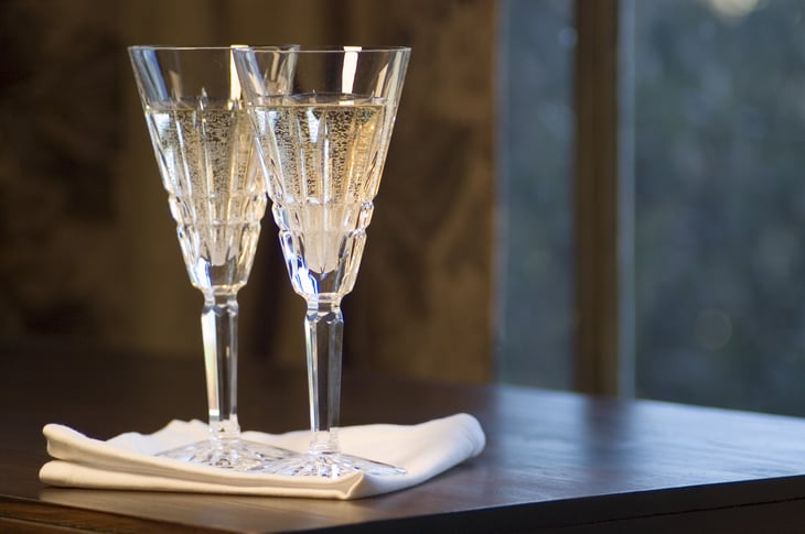 Two Waterford lead crystal champagne glasses