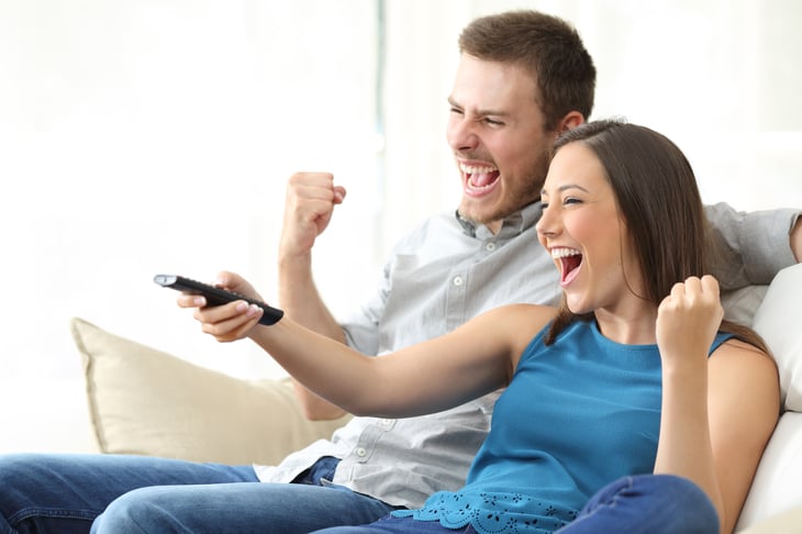A couple watches tv