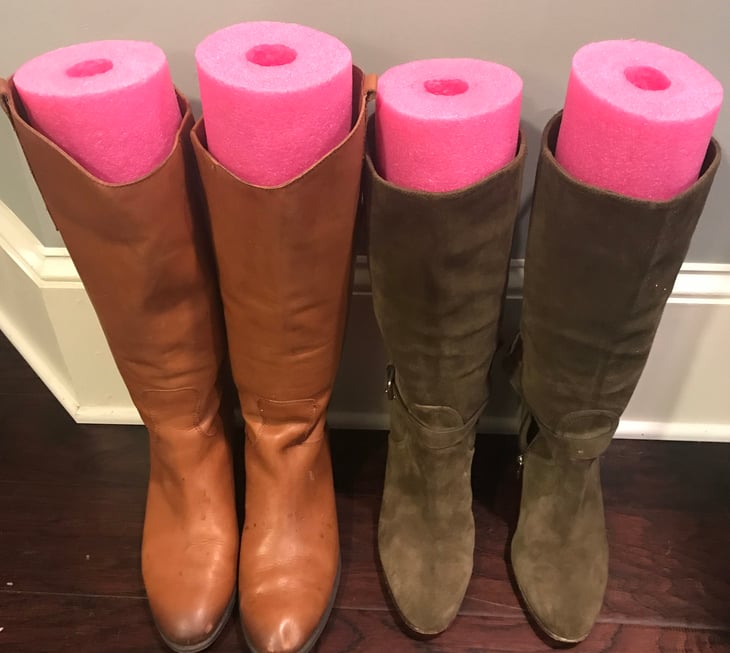 Boots held up by swim noodles.