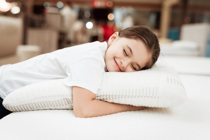 Girl hugging a pillow