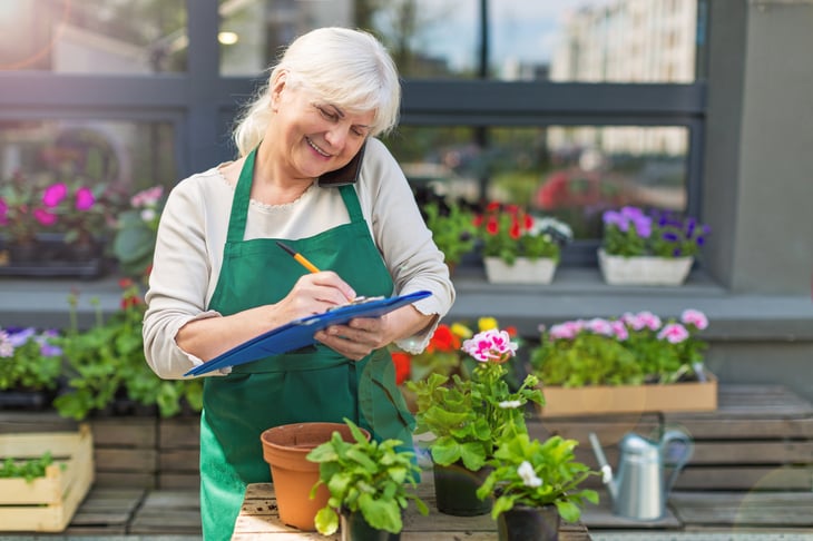 Older woman working at a florist shop
