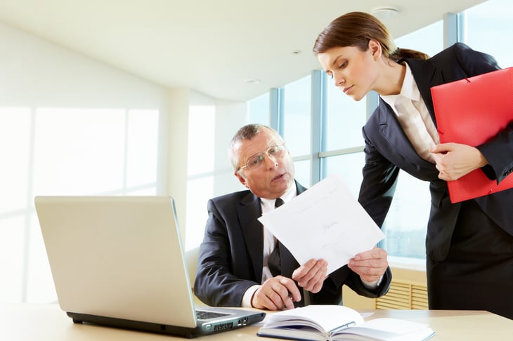 Businessman and woman in office