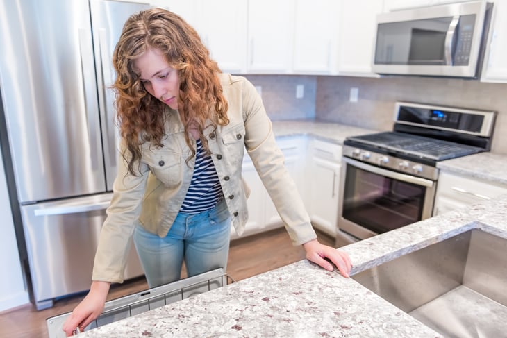 Woman looking at kitchen