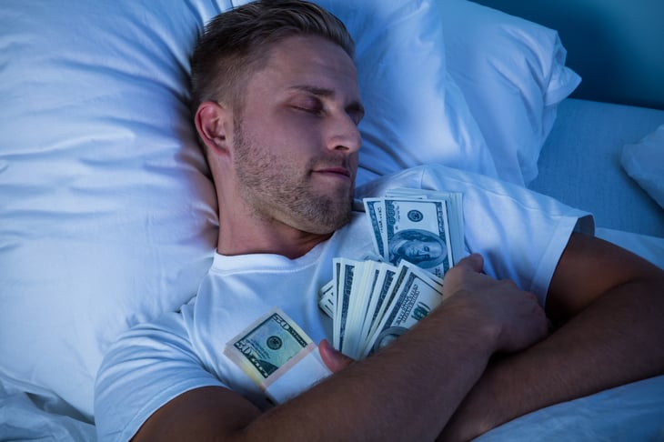 Man sleeping with money