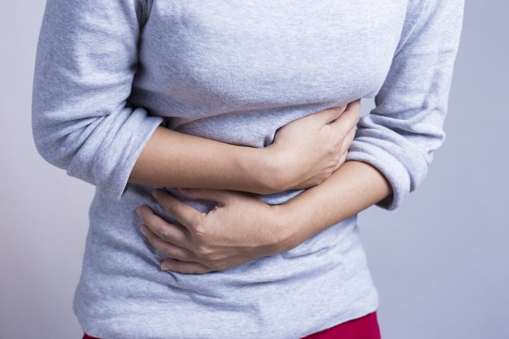 Woman holding her stomach