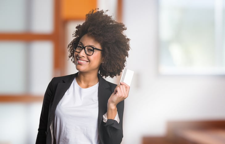 Happy-looking African American woman with credit card.