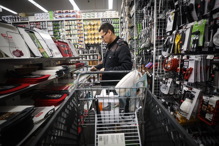 A man shops at a Bed Bath & Beyond store