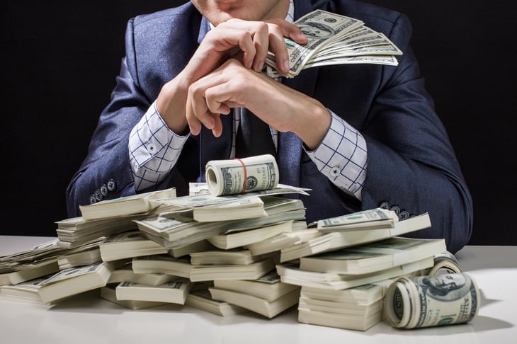 Wealthy businessman with cash
