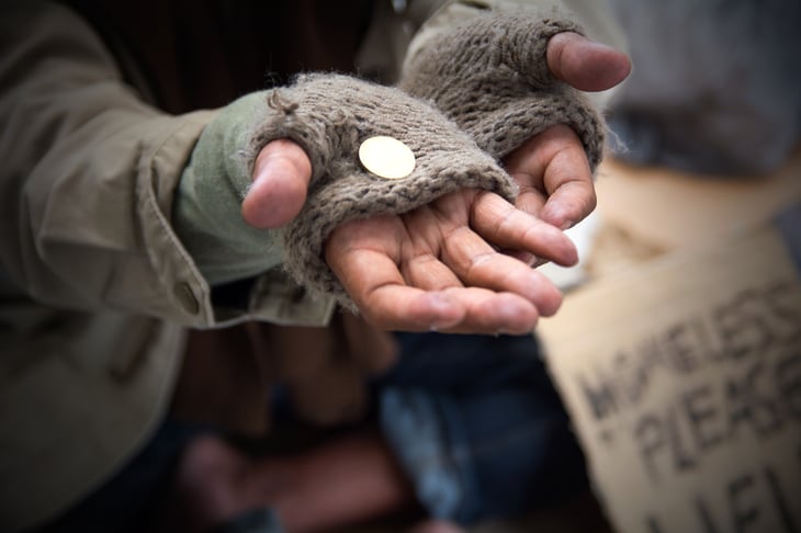 Hands of a homeless person begging.