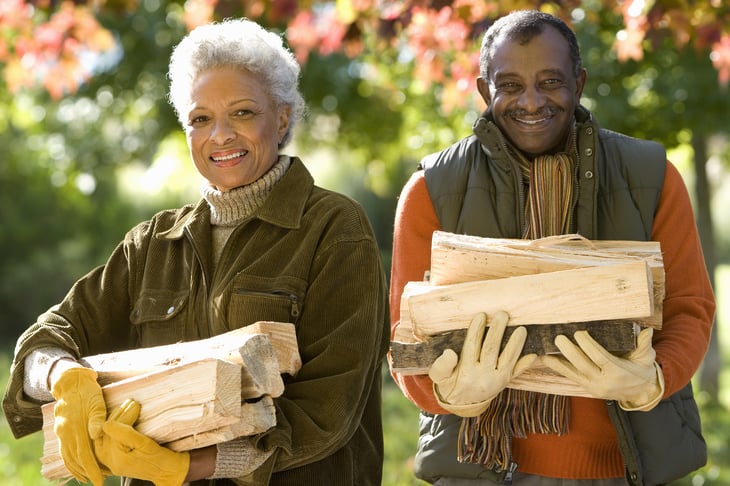 Couple carrying firewood