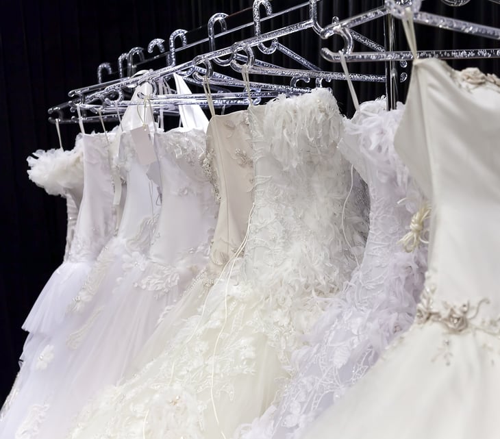 rack of wedding gowns