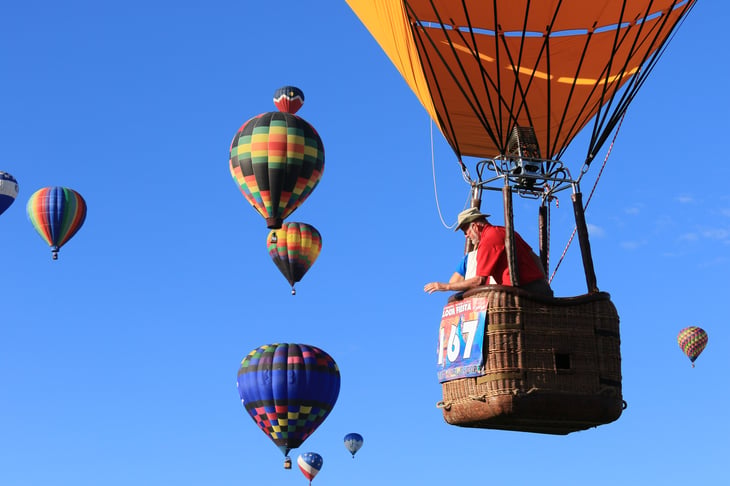 Senior man in hot air balloon