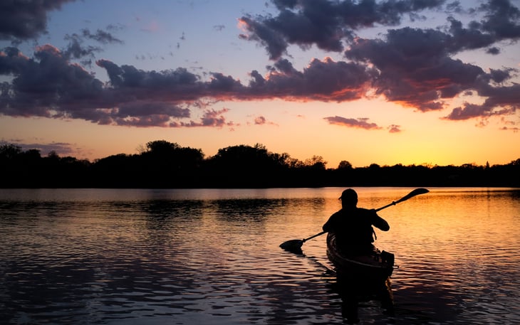 Man kayaking on Lake of the Isles, Minnesota