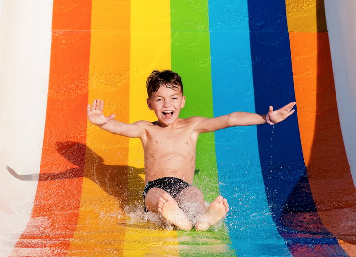 A kid on a water slide
