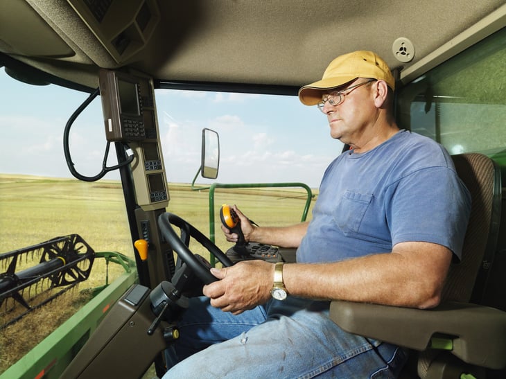 Farmer in harvester