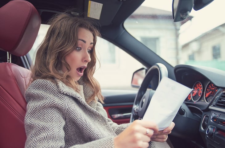 Woman reacting to fees