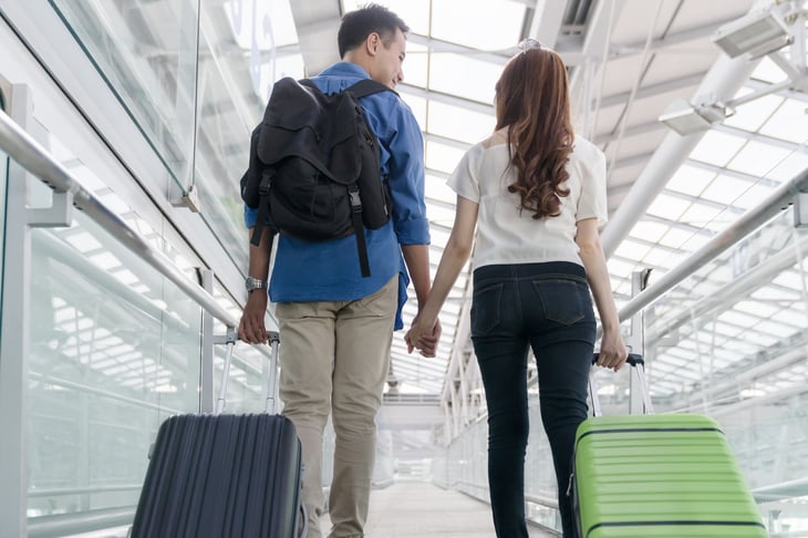 Airline passengers with carry-on bags