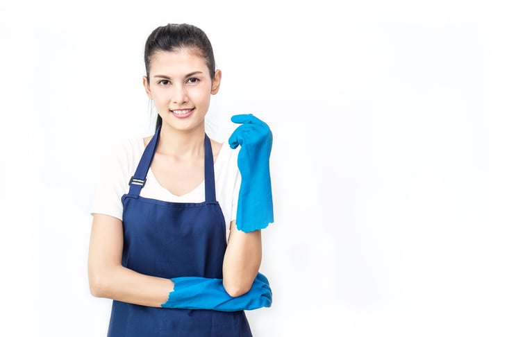 Female cleaner with gloves and apron