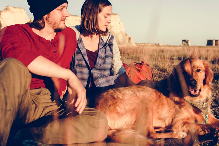 Couple and dog in a field in Kansas