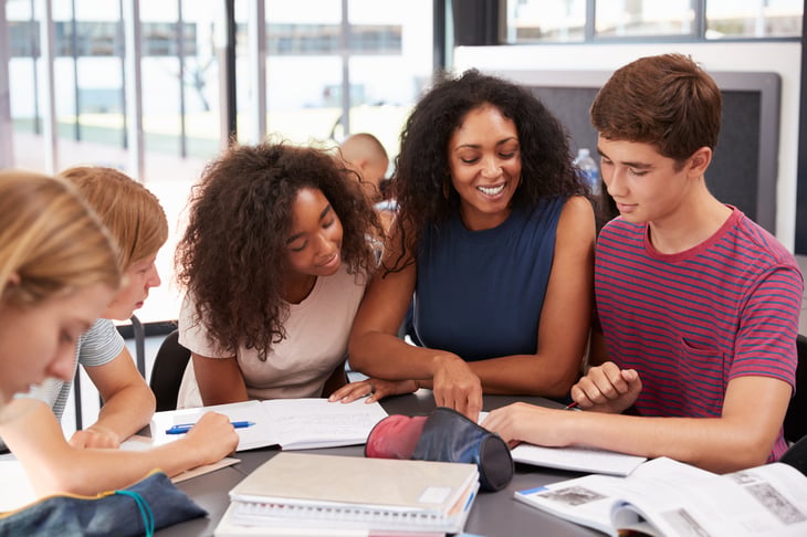 Teacher with students in a classroom