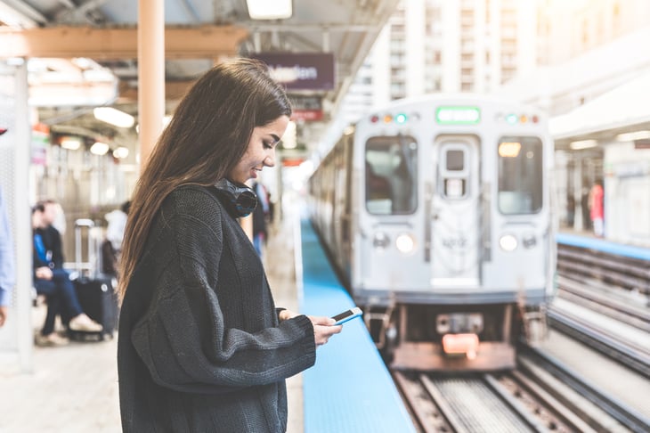 Woman waiting for an L train in Chicago