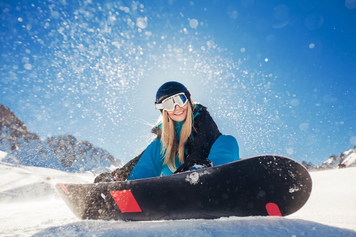 Woman snowboarding