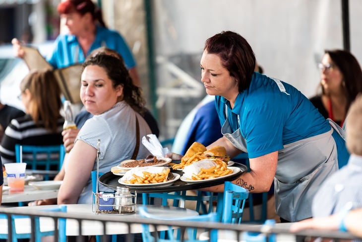New Orleans waitress serving cajun food.