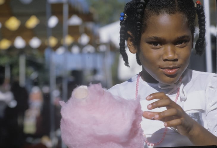 Girl eating cotton candy in Natchez, Mississippi