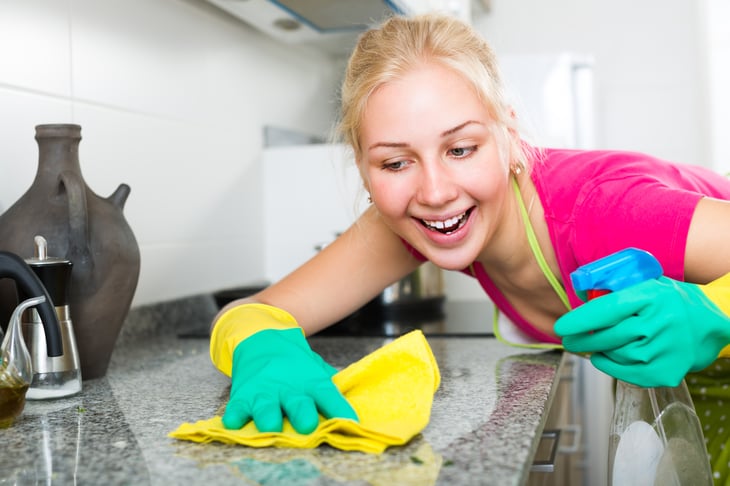 Woman cleaning her kitchen