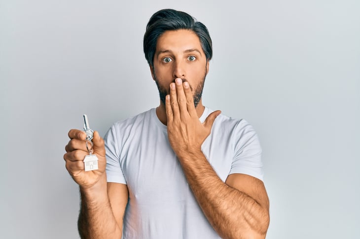 Worried man with house key