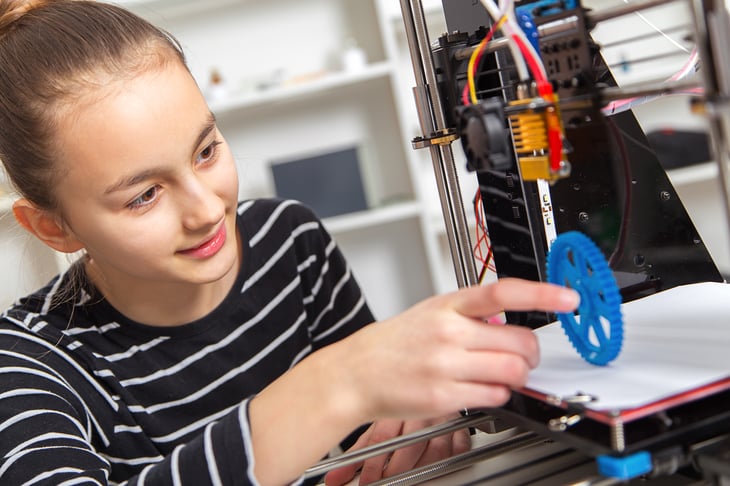 Child using a 3D printer
