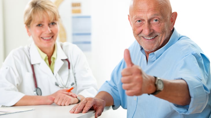Man giving thumbs up sign