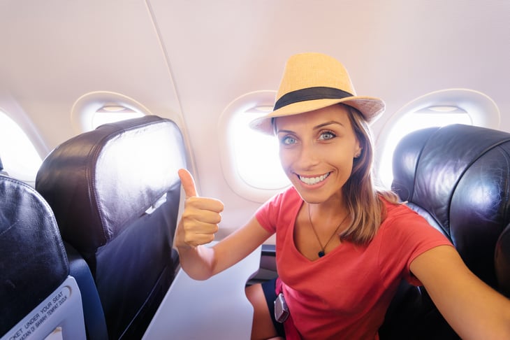 Young woman in plane