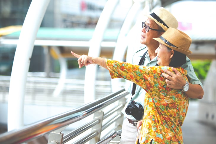 An older couple traveling on vacation