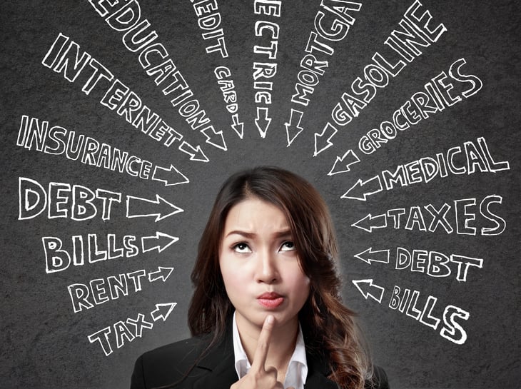 Woman thinking about monthly expenses