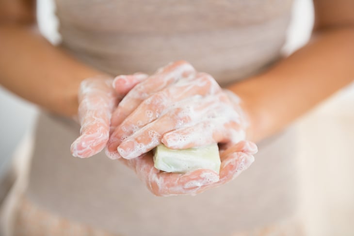 Woman with bar of soap