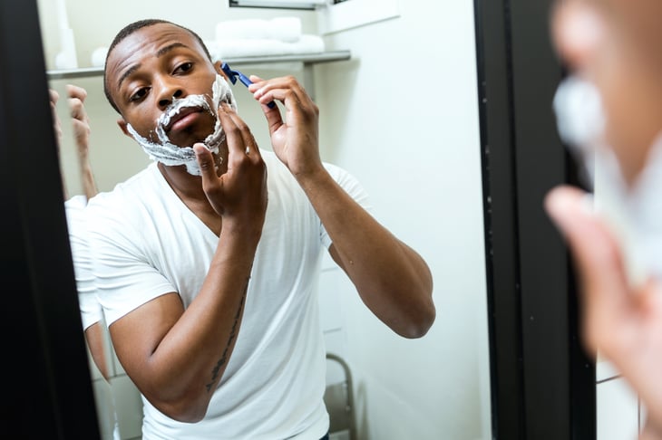 Black man shaving