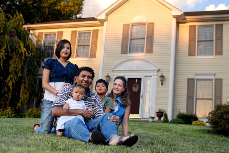 Family in front of a house