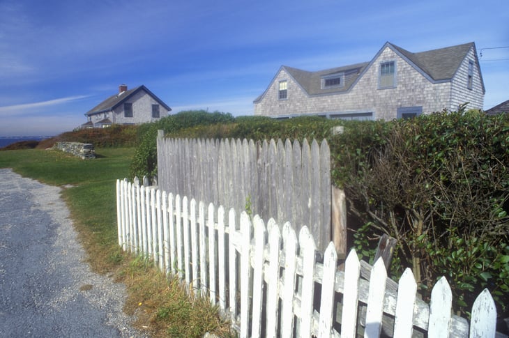 White picket fence along Route 77 in Sakonnet, Rhode Island