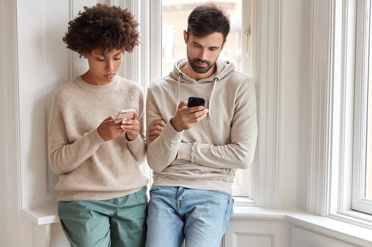 Couple using cellphones