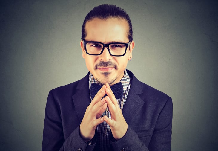 Sly businessman in glasses