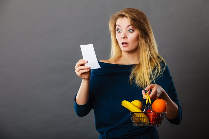 Shopper surprised by high prices on a grocery receipt