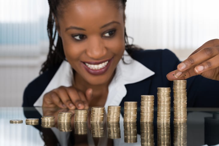 Woman piling up coins