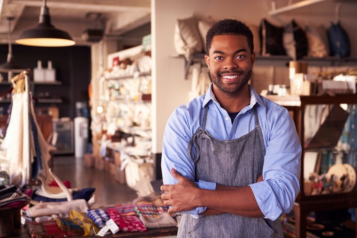 Gift shop owner, smiling