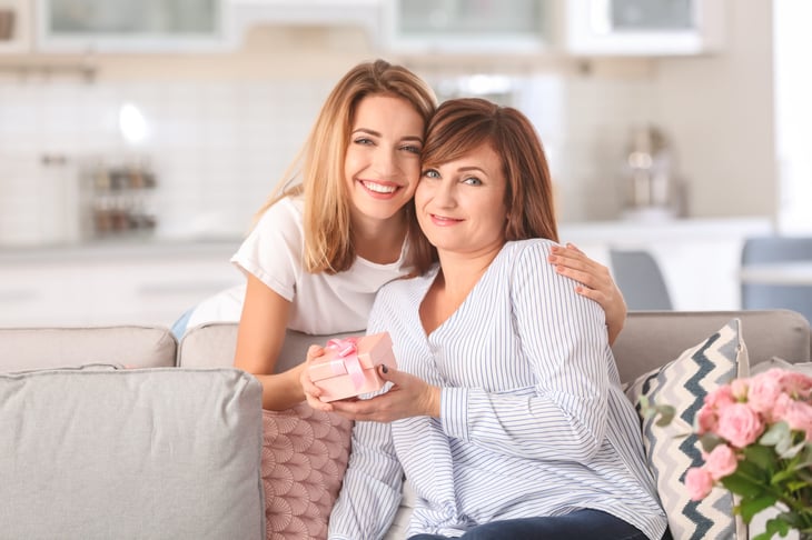 Daughter giving a gift to her mom