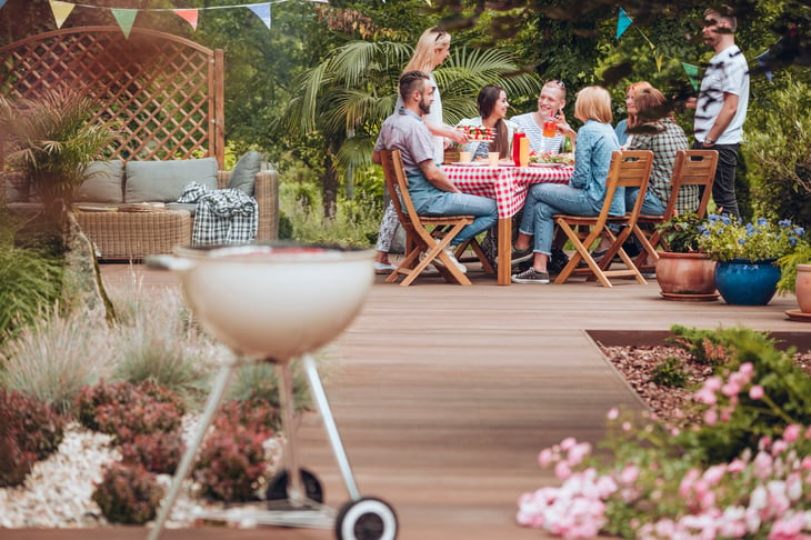 People gather on a patio for an outdoor party