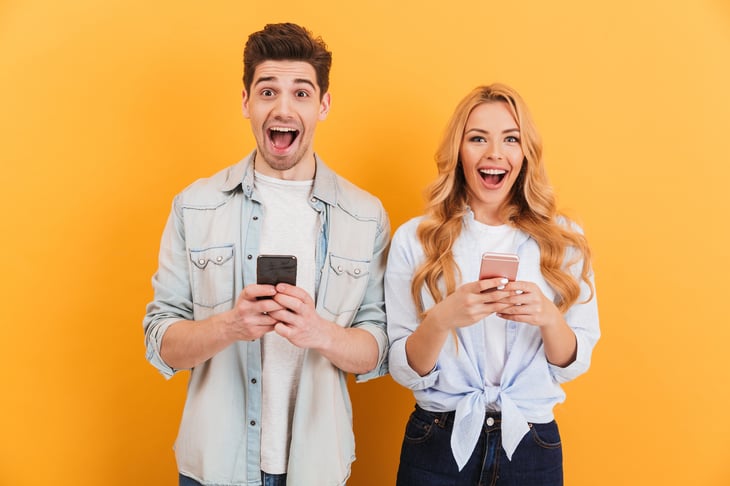 Happy people with cellphones